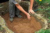 MAKING A SMALL POOL BY ADDING SAND PRIOR TO LINING