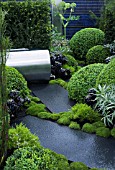 UP ON THE ROOF,  DES. JENNIFER HIRSCH. GREEN ROOF GARDEN WITH STEEL WATER BUTT & POLISHED STONE PAVING. INC. BOX (BUXUS SEMPERVIRENS),  SCLERANTHUS & AEONIUM