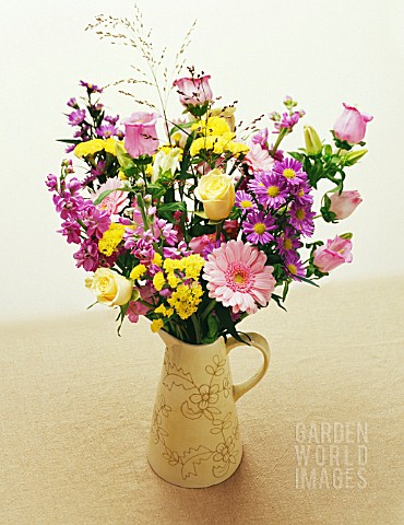 PINK_AND_YELLOW_THEMED_FLOWER_ARRANGEMENT_IN_JUG