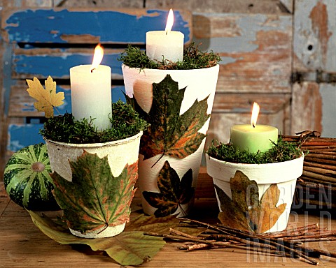 CANDLES_IN_FLOWERPOTS_EMBELLISHED_WITH_LEAVES