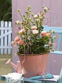PINK POT OF ROSES WITH DECORATIVE SUPPORT