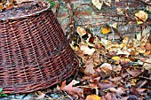 BASKET WITH LEAVES AS A WINTER NEST FOR HEDGEHOGS