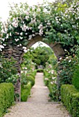 GOTHIC ARCH WITH RAMBLING ROSE AT HANHAM COURT