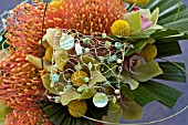 PROTEAS AND ORCHIDS USED IN MODERN BRIDAL BOUQUET