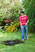 LAWN CARE - SPREADING SOIL AND SEEDS