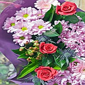 Colour themed boquet pink roses and pink lilac chrysanthemums