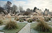 Frosted ornamental grass in classic italianate formal garden