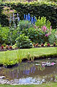 A COTTAGE GARDEN STYLE BORDER AND POND