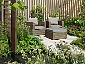 PATIO WITH SEATING AND CHAIRS AT THE BRINGING NATURE HOME GARDEN BY GRADUATE GARDENERS LTD