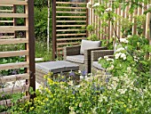 PATIO WITH SEATING AND CHAIRS AT THE BRINGING NATURE HOME GARDEN BY GRADUATE GARDENERS LTD