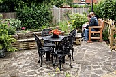 PATIO WITH BLACK WROUGHT IRON FURNITURE