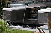 STEEL AND GLASS WATERFALL. FLEMINGS NURSERIES AUSTRALIAN GARDEN,  DES. DEAN HERALD