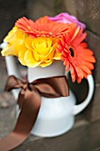 FLOWERS IN TEAPOT WITH RIBBON