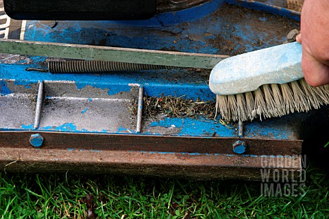 CLEANING_LAWNMOWER_WITH_BRUSH