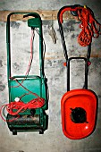 HANG UP ELECTRIC MOWERS IN SHED