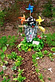 SCARECROW IN VEGETABLE GARDEN