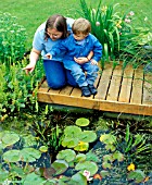 POND WATCHING, CHILD SUPERVISED BY ADULT