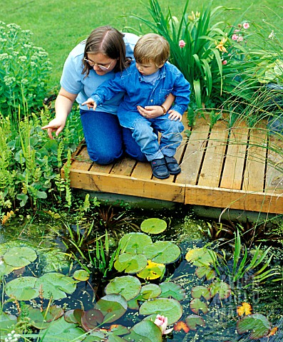 POND_WATCHING_CHILD_SUPERVISED_BY_ADULT