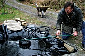 BUILDING POOL,  LOWER PUMP INTO POND