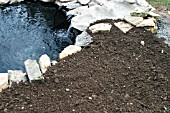 FINISHED POND, BACK FILLED WITH SOIL