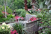 TROPICAL GARDEN SCENE WITH BENCHES