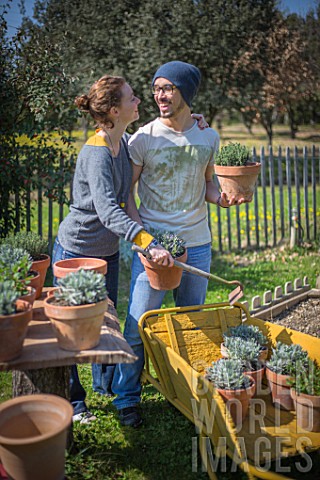 Young_couple_with_aromatic_plants_in_a_garden