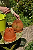 Cleaning of pots in a garden