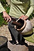 Cleaning of pots in a garden