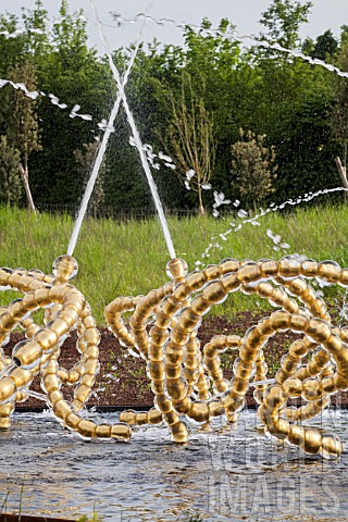 Jets_of_water_and_sculptures_at_Bosquet_du_theatre_deau_Gardens_of_Versailles_France_Garden_design__