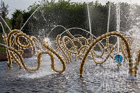 Jets_of_water_and_sculptures_at_Bosquet_du_theatre_deau_Gardens_of_Versailles_France_Garden_design__