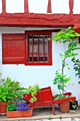 Facade of a house decorated in the Basque village of Lasbastide Clairence, Aquitaine, France