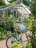 Bicycle in front of a greenhouse, Jardin Insolite, Parc Floral Vincennes, Paris, France