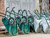 Stored wheelbarrows overturned