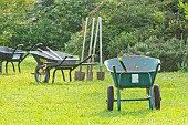 Gardening equipment, wheelbarrows, spades... cleaning the garden in autumn