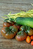 Harvest from the vegetable garden: courgette (Cucurbita pepo), butter beans (Phaseolus vulgaris), tomatoes (Solanum lycopersicum)