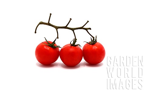 Three_ripe_red_tomatoes_on_a_light_background_Natural_product