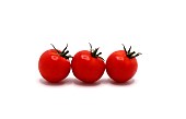 Three red tomatoes on a light background. Natural product.
