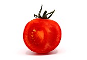 Half ripe red tomato on a light background. Natural product. Natural color. Close-up.