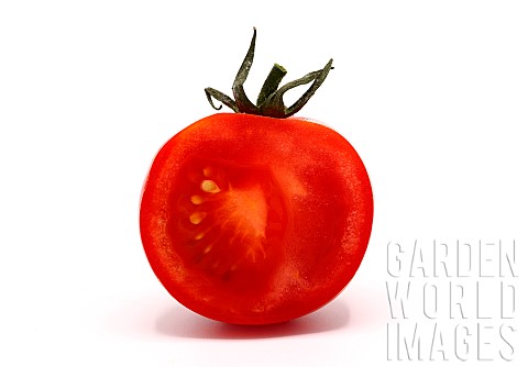 Half_ripe_red_tomato_on_a_light_background_Natural_product_Natural_color_Closeup