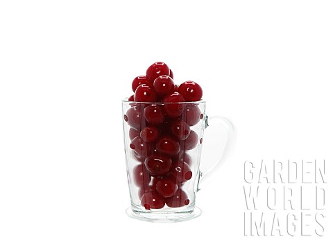 Ripe_cherry_in_a_transparent_glass_on_a_light_background_Natural_product_Natural_color_Closeup