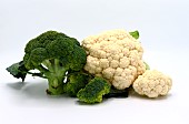 Raw broccoli and cauliflower on a light background. Natural product. Natural hue. Close-up.