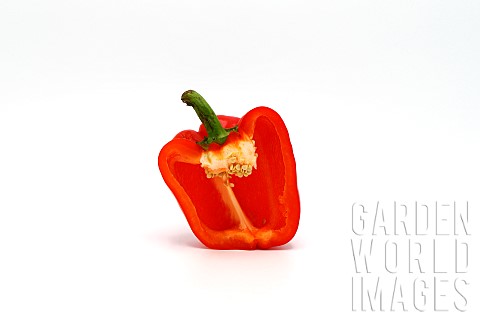 One_red_ripe_sweet_pepper_in_a_cut_on_a_light_background_Natura