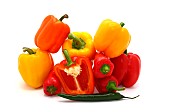 Composition of several types of sweet pepper of different shapes, colors and sizes on a light background. Natural product. Natural color. Close-up.