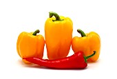 Composition of yellow and red sweet peppers of different sizes on a light background. Natural product. Natural color. Close-up.