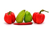 Composition of several types of sweet pepper of different shapes, colors and sizes on a light background. Natural product. Natural color. Close-up.