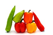 Composition of several types of sweet pepper of different shapes, colors and sizes on a light background. Natural product. Natural color. Close-up.