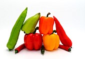 Composition of several types of sweet pepper of different shapes, colors and sizes on a light background. Natural product. Natural color. Close-up.