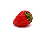 One ripe strawberry on a light background. Natural color and shape. Close-up.