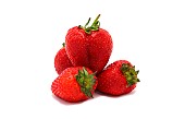 Several ripe strawberries on a light background. Natural color and shape. Close-up.