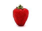 One ripe strawberry on a light background. Natural color and shape. Close-up.